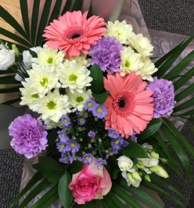 Sweet Melody - A pretty bouquet combining vibrant pink, soft purple and creamy white tones with fresh, sweeping greenery.