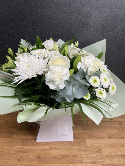 White Whisper - This exquisite bouquet features delicate whites, exuding grace and serenity—perfect for any occasion and a timeless gift of sophistication.